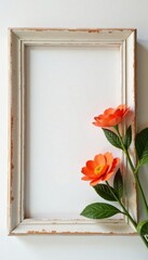 Artificial flowers in a distressed wooden frame on a soft white background, floral wall, distressed wood, garden decor