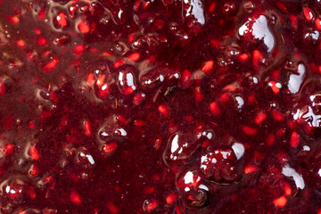 Crumpled sweet raspberries with added sugar