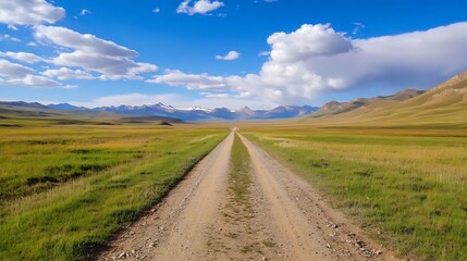 Fototapeta premium Expansive scenic landscape featuring a dirt road leading through lush fields and mountains in the distance : Generative AI