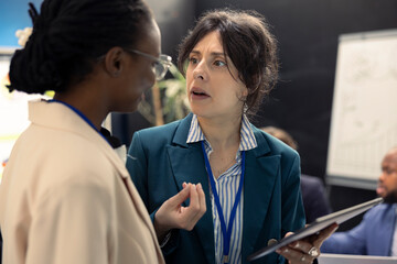 Business colleagues evaluating performance indicators within the company, conducting evaluations...