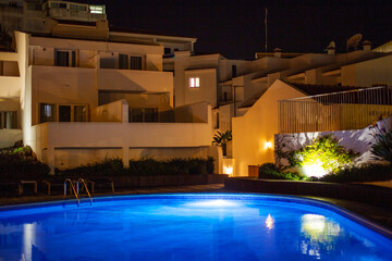 Swimming pool at night in a luxury hotel. Selective focus.