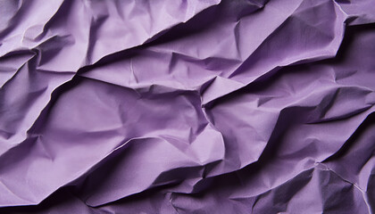 Obraz premium Crumpled purple paper texture for creative backgrounds and design projects