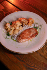 Baked turkey and cauliflower are a delicious dish on the menu at the restaurant. A beautiful and delicious photo for a menu, culinary website, or an advertisement for catering establishments.