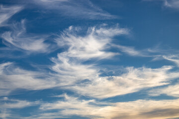wispy clouds at sunset