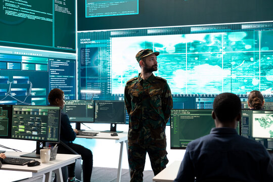 Government military hackers engaged in hybrid warfare strategies. Using sophisticated software and technology to secure information, prevent breaches and protect military operations.