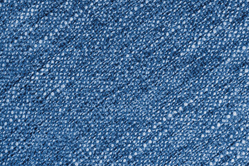Blue Jacquard fabric with large loose diagonal woven, coarse weave texture upholstery cloth. Textile background, furniture textile material, wallpaper, backdrop. Cloth structure close up, macro.
