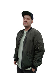 Portrait of a young man in a green jacket and cap on the street
