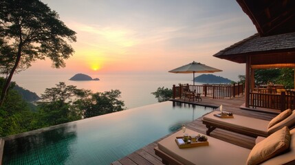 Fototapeta premium Sunset view from a private infinity pool at an exclusive island resort.
