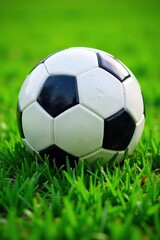 Obraz premium Soccer ball's inflated surface on emerald green grass, green, soccer ball, outdoors