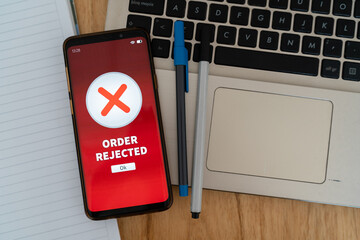 Order rejected notification on smartphone. Concept of problems at online checkout.