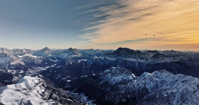 Aerial drone view of the Marmolada mountain in the Dolomites, northeastern Italy with the blue sky on the background
