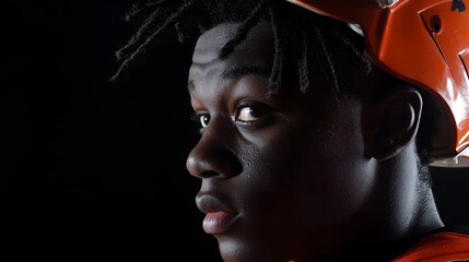 Intense American football player in helmet, focused and determined, embodies strength and resilience