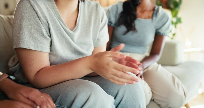 Sad woman, hands and friends in home for support, sympathy and harassment abuse victim. Empathy, life story and female people on couch talking for depression, grief counseling or therapy together