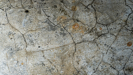 Close-up of cracked and weathered concrete. Texture, grunge, and abstract background.