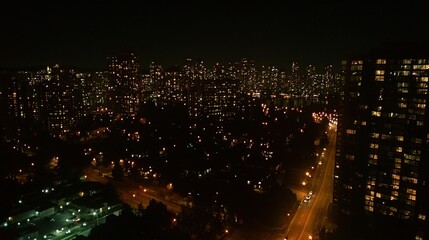 Fototapeta premium Nighttime Cityscape Illuminating Residential Buildings and Streets