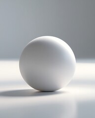 A minimalistic white sphere placed on a smooth reflective surface with soft lighting, symbolizing simplicity, balance, and geometric beauty in a serene environment.

