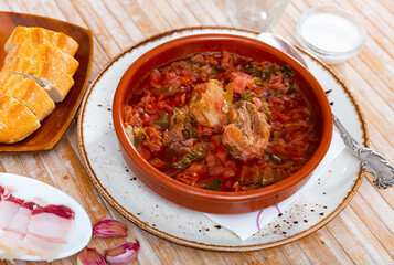 Traditional dish of Slavic cuisine called Borsch, cooked in meat broth from beets, cabbage, potatoes, carrots and onions