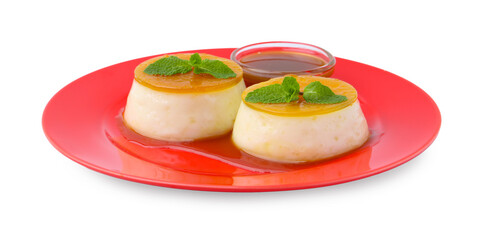 Tasty puddings with caramel sauce and mint isolated on white