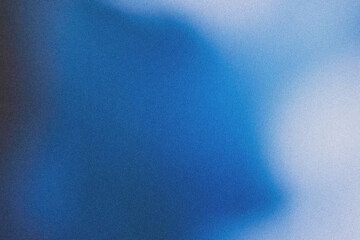 Blue blurred gradient abstract background with noise.