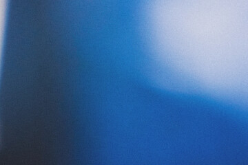 Blue blurred gradient abstract background with noise.