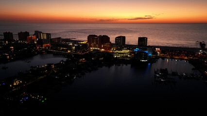 Obraz premium Colorful Sunset At Clearwater In Florida United States. Sunset Beach. Illuminated Cityscape. Downtown City. Colorful Sunset At Clearwater In Florida United States. Amazing Sunset Skyline.