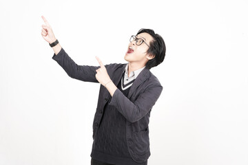 Shocked wow face Presenting and pointing up with forefinger on copyspace for advertising Of Handsome Asian Man Isolated On White Background