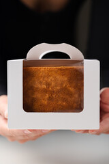 Freshly baked Honey cake in a white gift box. Bento cake.