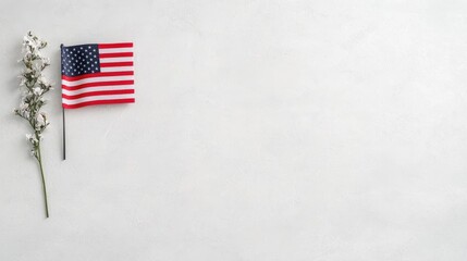 Fototapeta premium American flag, white flowers, grey background; Memorial Day
