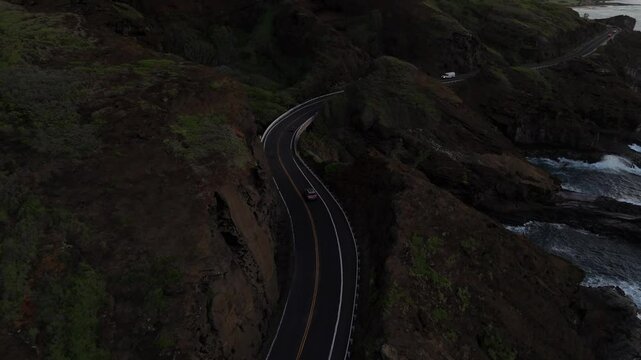Aerial view of a Coastal highway in Hawaii next to ocean
