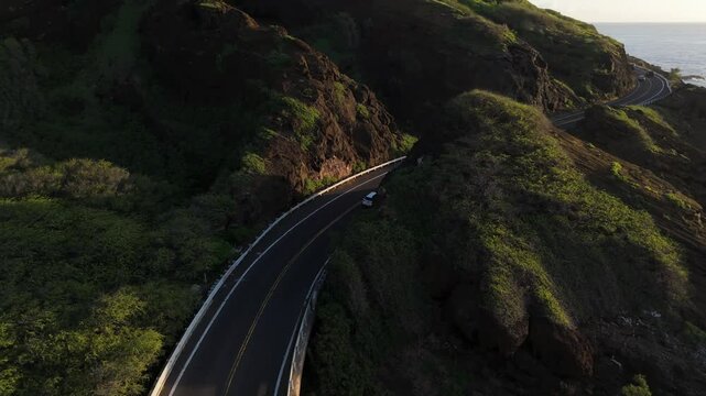 Aerial view of a Coastal highway in Hawaii next to ocean