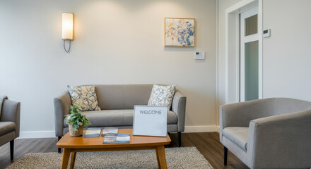 A living room with a couch, a coffee table, and two chairs