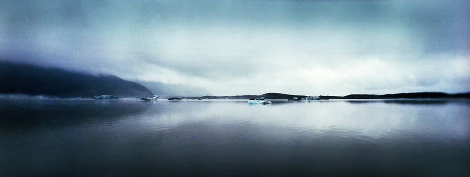 Panoramic view of Black sand beach and glaciers on a foggy day, Skaftafell National Park, Southern Iceland, Iceland.