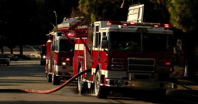 Red fire engines respond to the scene of an emergency.