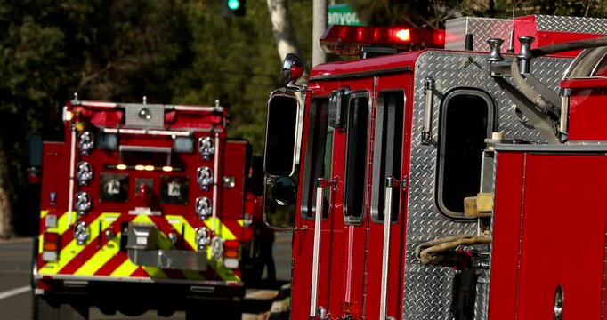 Red fire engines respond to the scene of an emergency.