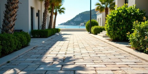 Sun-dappled Pathway Leading to a Serene Coastal View, Flanked by Lush Greenery and Elegant Architectural Details