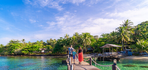 family in tropical beach resort