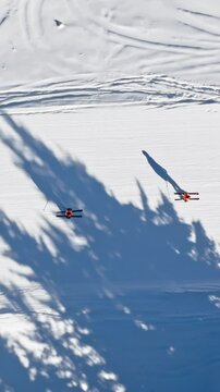 Aerial drone view of a ski resort in Col dei Baldi, Alleghe, in the Dolomites, Italy in daylight. Vertical