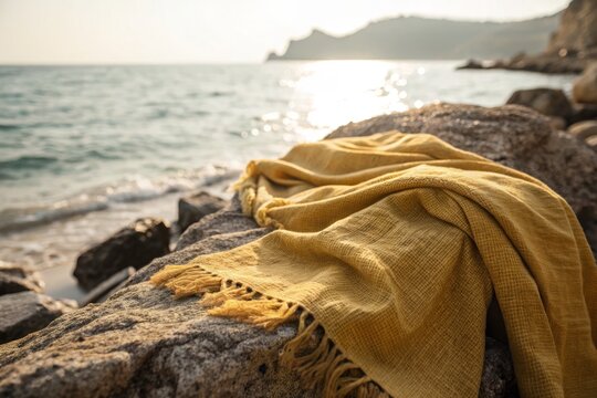 Weaving Sunlight: Golden Kanzu Draped Over Sun-Kissed Rocks, Coastal Food Photography