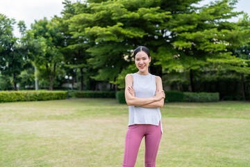 Fototapeta premium Portrait of Asian beautiful woman exercise outdoors park in morning. 
