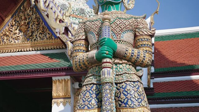 Guardian Yaksha stands on grounds of Emerald Buddha complex