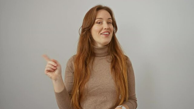 Woman pointing at herself and gesturing no with her finger against a white background depicting expressions with red hair and wearing a brown sweater.