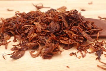 A pile of burnt fried onions, close-up.