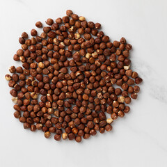 peeled hazelnut. Top view. Background from hazelnuts. natural high calorie snacks