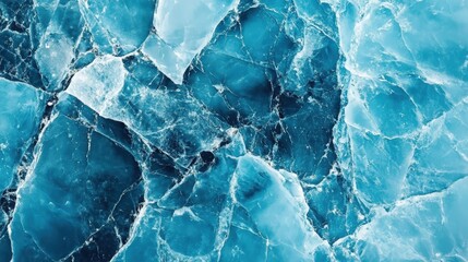 Obraz premium Beautiful winter natural blue ice texture of surface of frozen. Nature abstract pattern of white cracks. Winter seasonal background, mock up, flat lay, ice texture background