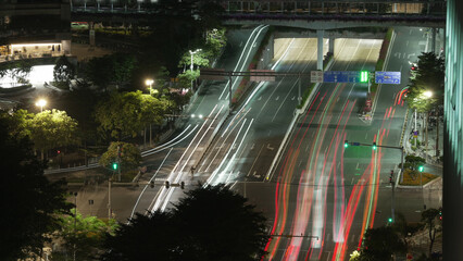 Lot cars drive urban busy road time lapse. Crowded city street rush hour China. Many asian chinese...
