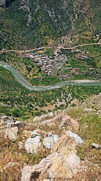 Zom Village nestled by a winding river in a lush mountain valley, breathtakingly serene.
📍Zom, Hawraman - Kurdistan 