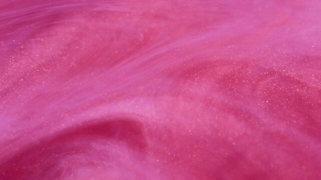 Ink water drop. Shimmering glitter. Defocused bright pink cloud ink mist vortex vapor paint steam moving on abstract art background.