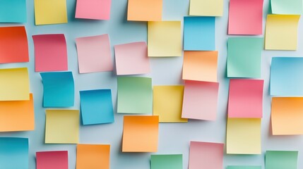 Colorful Sticky Notes: A vibrant collection of pastel-colored sticky notes arranged in an overlapping pattern, creating a visually engaging and textured background perfect for ideas, reminders.