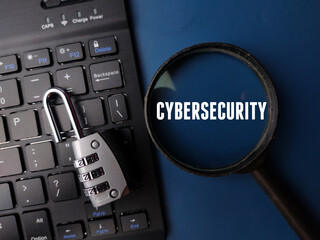 Keyboard and padlock with the word CYBERSECURITY on a blue background