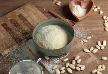 Almond flour in bowl. Nuts on table. Healthy food and products. Organic ingredients and vegan nutrition. 